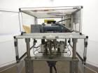 Used Resina Model RT-20 cap tightener retorquer. Capable of speeds up to 90 bottles per minute. Cap size range: 13mm to 38mm. C frame desing, has two sets of cap tightening wheel, single side belt gr...