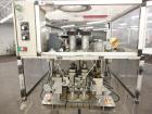 Used Resina Model RT-20 cap tightener retorquer. Capable of speeds up to 90 bottles per minute. Cap size range: 13mm to 38mm. C frame desing, has two sets of cap tightening wheel, single side belt gr...