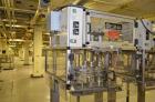 Used Resina Model RT-20 cap tightener retorquer. Capable of speeds up to 90 bottles per minute. Cap size range: 13mm to 38mm. C frame desing, has two sets of cap tightening wheel, single side belt gr...