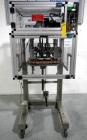 Used Resina Model RT20-53 Cap Tightener Retorquer. Capable of speeds up to 90 bottles per minute. Cap size range: 13mm to 38mm. C frame desing, has two sets of cap tightening wheel, single side belt ...