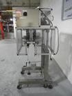 Used Resina Model RT20-53 Cap Tightener Retorquer. Capable of speeds up to 90 bottles per minute. Cap size range: 13mm to 38mm. C frame desing, has two sets of cap tightening wheel, single side belt ...