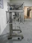 Used Resina Model RT20-53 Cap Tightener Retorquer. Capable of speeds up to 90 bottles per minute. Cap size range: 13mm to 38mm. C frame desing, has two sets of cap tightening wheel, single side belt ...