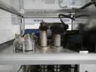 Used Resina Model RT20-53 Cap Tightener Retorquer. Capable of speeds up to 90 bottles per minute. Cap size range: 13mm to 38mm. C frame desing, has two sets of cap tightening wheel, single side belt ...
