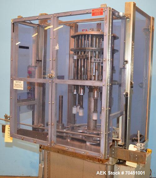 Used Consolidated Capem Model C4HB 8 Head Rotary Cap Press with Star Wheel Infeed and Discharge.