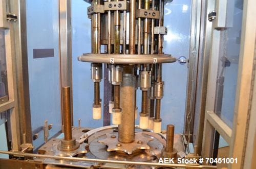 Used Consolidated Capem Model C4HB 8 Head Rotary Cap Press with Star Wheel Infeed and Discharge.