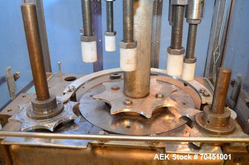 Used Consolidated Capem Model C4HB 8 Head Rotary Cap Press with Star Wheel Infeed and Discharge.