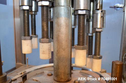 Used Consolidated Capem Model C4HB 8 Head Rotary Cap Press with Star Wheel Infeed and Discharge.