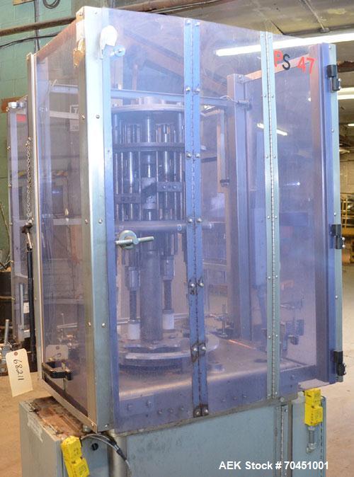 Used Consolidated Capem Model C4HB 8 Head Rotary Cap Press with Star Wheel Infeed and Discharge.