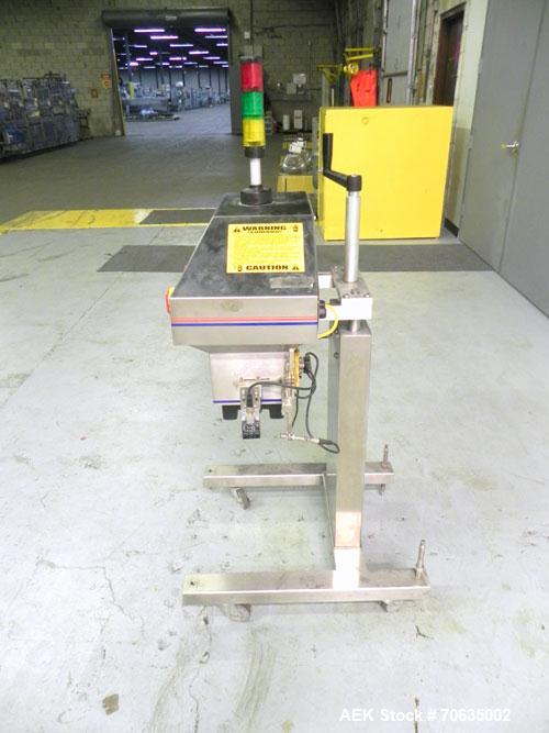 Used Automate Technologies Cap Induction Sealer, Model AM-20. Approximately 3" wide x 21" long seal area, air cooled. Mounted on a stainless steel adjustable height frame with casters.
