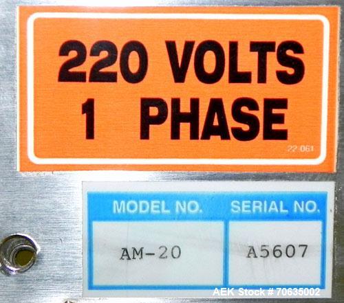 Used Automate Technologies Cap Induction Sealer, Model AM-20. Approximately 3" wide x 21" long seal area, air cooled. Mounted on a stainless steel adjustable height frame with casters.