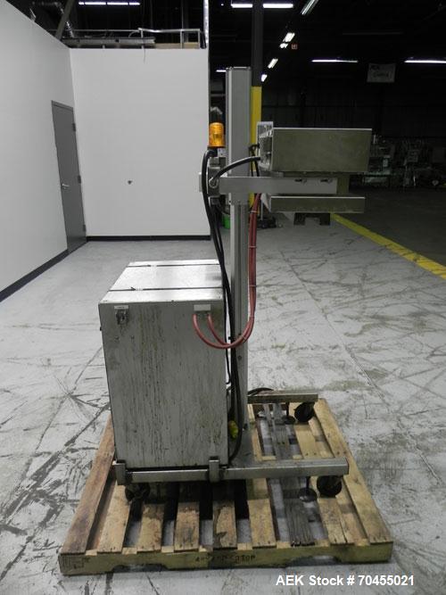 Used Enercon Model Compak 3100 Induction Sealer. Has 2" (wide) by 1" (tall) seal bar opening. Stainless steel enclosure, washdown unit. Mounts over conveyor. Has casters. Water cooled. 1kw rated. 15 ...