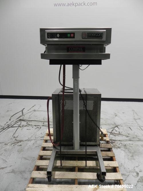 Used Enercon Model Compak 3100 Induction Sealer. Has 2" wide by 1" tall seal bar tunnel opening. Stainless steel enclosure. Mounts over conveyor. Has casters. Water cooled. 1 kw rated. 15 amp. 0.35 G...