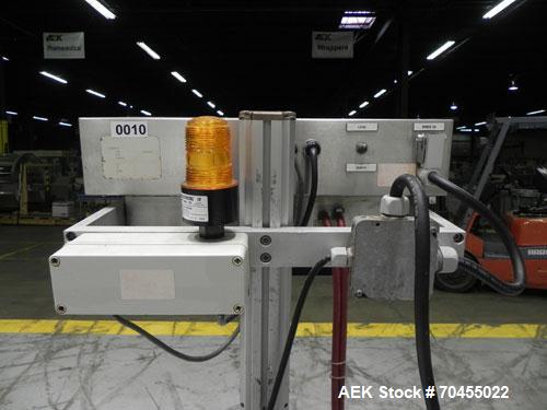 Used Enercon Model Compak 3100 Induction Sealer. Has 2" wide by 1" tall seal bar tunnel opening. Stainless steel enclosure. Mounts over conveyor. Has casters. Water cooled. 1 kw rated. 15 amp. 0.35 G...