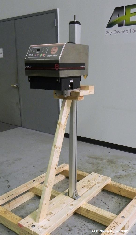 Used Enercon Super Seal 100 Air Cooled Induction Sealer. Has a 1.25" (wide) by 2" (tall) seal head opening. Ideal for 'Yorker Tip' caps & other style. Mounted on Adjustable Aluminum Stand. Built 2009.
