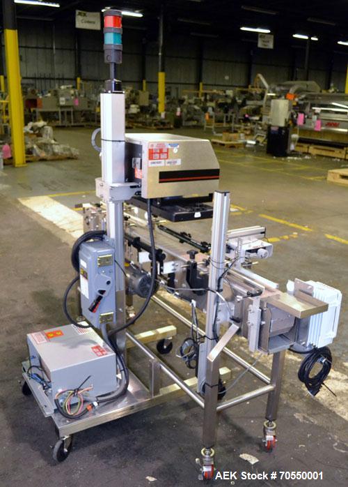 Used Enercon Superseal DX Air Cooled Induction Sealer. Model LM4466-1. 3/50/60 HZ, 240 volt, 8.7 amps. Mounted on an adjustable height stand. Includes seal detection, stalled bottle sensor, input tra...
