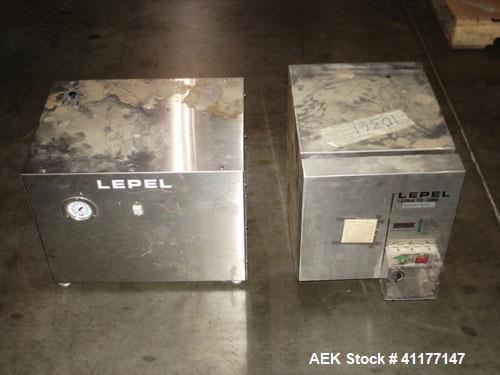 Used Lepel Induction Cap Sealer, Model TA-2000A. Capable of speeds over 200 feet per minute. Stainless steel cabinet. Water cooled, flat bar. Includes a chiller, model LWA-3, Serial #9580. 3/60/208/2...