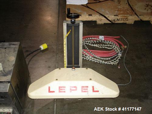 Used Lepel Induction Cap Sealer, Model TA-2000A. Capable of speeds over 200 feet per minute. Stainless steel cabinet. Water cooled, flat bar. Includes a chiller, model LWA-3, Serial #9580. 3/60/208/2...