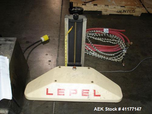 Used Lepel Induction Cap Sealer, Model TA-2000A. Capable of speeds over 200 feet per minute. Stainless steel cabinet. Water cooled, flat bar. Includes a chiller, model LWA-3, Serial #9580. 3/60/208/2...