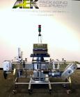 Used Enercon Superseal DX Air Cooled Induction Sealer. Model LM4466-1. 3/50/60 HZ, 240 volt, 8.7 amps. Mounted on an adjustable height stand. Includes seal detection, stalled bottle sensor, input tra...