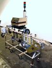 Used Enercon Superseal DX Air Cooled Induction Sealer. Model LM4466-1. 3/50/60 HZ, 240 volt, 8.7 amps. Mounted on an adjustable height stand. Includes seal detection, stalled bottle sensor, input tra...