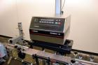Used Enercon Superseal DX Air Cooled Induction Sealer. Model LM4466-1. 3/50/60 HZ, 240 volt, 8.7 amps. Mounted on an adjustable height stand. Includes seal detection, stalled bottle sensor, input tra...