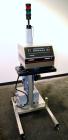 Used Enercon Superseal DX Air Cooled Induction Sealer. Model LM4466-1. 3/50/60 HZ, 240 volt, 8.7 amps. Mounted on an adjustable height stand. Includes seal detection, stalled bottle sensor, input tra...