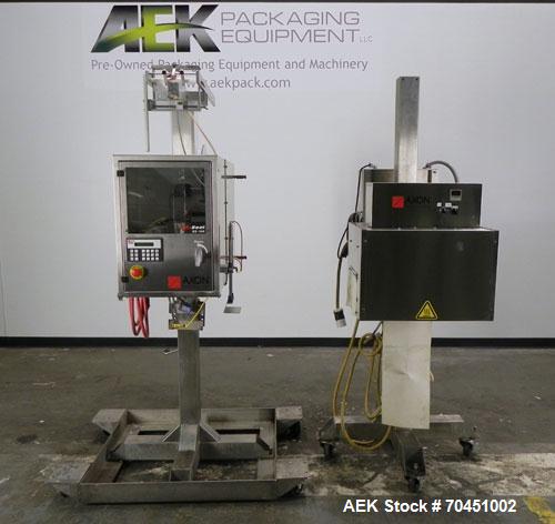 Used Axon Model EZ-100 Heat Shrink Tamper Evident Band & Sleeve Label Applicator. Rated up to 150 ppm depending on the container. Machine is of stainless steel construction. Sleeve size 20 to 100mm f...
