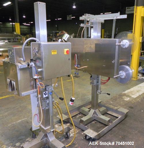 Used Axon Model EZ-100 Heat Shrink Tamper Evident Band & Sleeve Label Applicator. Rated up to 150 ppm depending on the container. Machine is of stainless steel construction. Sleeve size 20 to 100mm f...