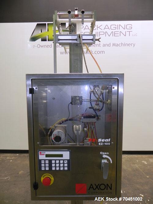 Used Axon Model EZ-100 Heat Shrink Tamper Evident Band & Sleeve Label Applicator. Rated up to 150 ppm depending on the container. Machine is of stainless steel construction. Sleeve size 20 to 100mm f...