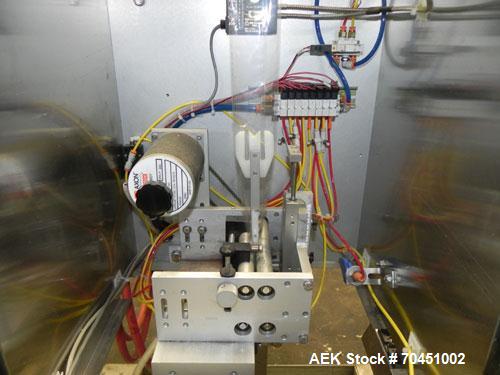 Used Axon Model EZ-100 Heat Shrink Tamper Evident Band & Sleeve Label Applicator. Rated up to 150 ppm depending on the container. Machine is of stainless steel construction. Sleeve size 20 to 100mm f...