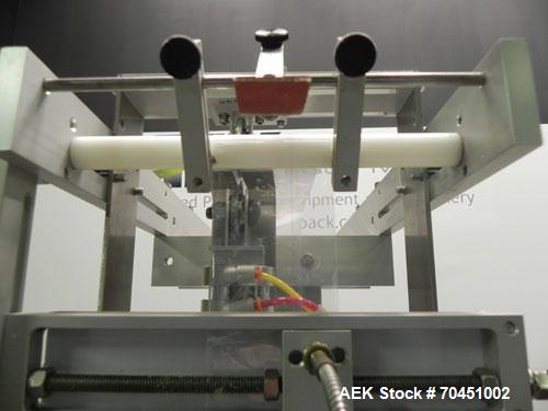 Used Axon Model EZ-100 Heat Shrink Tamper Evident Band & Sleeve Label Applicator. Rated up to 150 ppm depending on the container. Machine is of stainless steel construction. Sleeve size 20 to 100mm f...