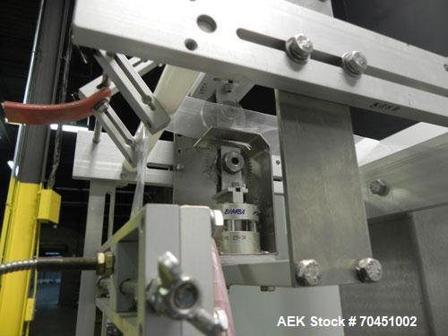 Used Axon Model EZ-100 Heat Shrink Tamper Evident Band & Sleeve Label Applicator. Rated up to 150 ppm depending on the container. Machine is of stainless steel construction. Sleeve size 20 to 100mm f...