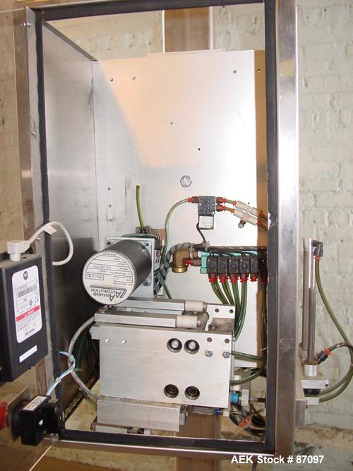 Used Axon Heat Shrink Tamper Evident Band & Sleeve Label Applicator, Model EZ100, Stainless Steel. Rated up to 150 ppm depending on the container. Sleeve size 20 to 100mm flat x 25 to 200mm high x 40...