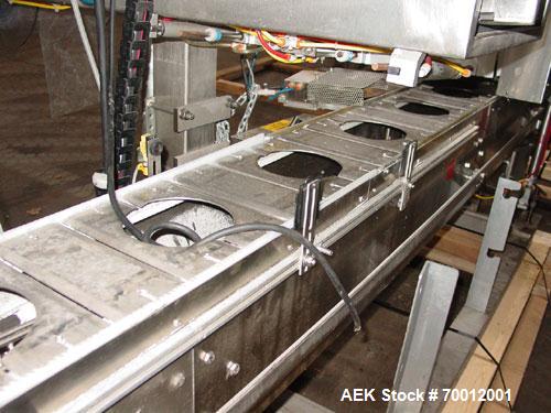 Used Axon EZ300 Stainless Steel Neck Bander With Stainless Steel Tunnel. Capable of speeds up to 70 containers per minute. Can handle product container widths from 2-3/8" to 7-3/8" and sleeve lay fla...