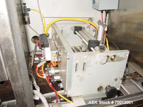 Used Axon EZ300 Stainless Steel Neck Bander With Stainless Steel Tunnel. Capable of speeds up to 70 containers per minute. Can handle product container widths from 2-3/8" to 7-3/8" and sleeve lay fla...