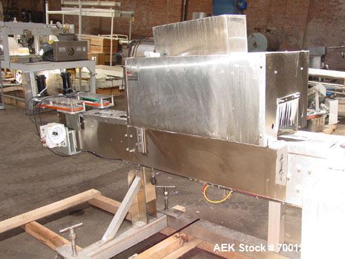 Used Axon EZ300 Stainless Steel Neck Bander With Stainless Steel Tunnel. Capable of speeds up to 70 containers per minute. Can handle product container widths from 2-3/8" to 7-3/8" and sleeve lay fla...
