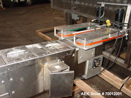Used Axon EZ300 Stainless Steel Neck Bander With Stainless Steel Tunnel. Capable of speeds up to 70 containers per minute. Can handle product container widths from 2-3/8" to 7-3/8" and sleeve lay fla...