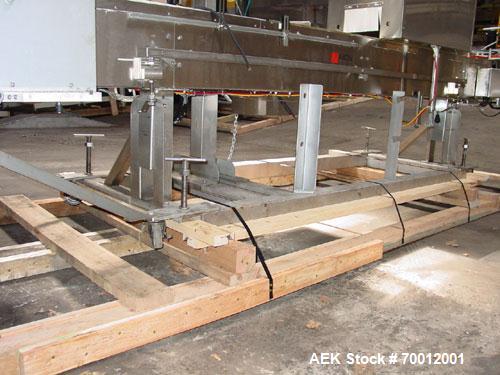 Used Axon EZ300 Stainless Steel Neck Bander With Stainless Steel Tunnel. Capable of speeds up to 70 containers per minute. Can handle product container widths from 2-3/8" to 7-3/8" and sleeve lay fla...