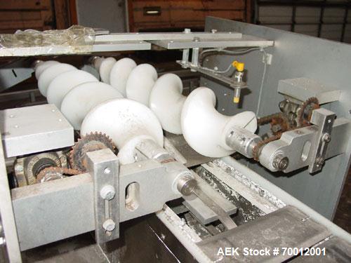 Used Axon EZ300 Stainless Steel Neck Bander With Stainless Steel Tunnel. Capable of speeds up to 70 containers per minute. Can handle product container widths from 2-3/8" to 7-3/8" and sleeve lay fla...