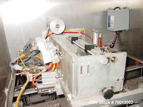 Used Axon EZ-2-400 Twin Head Stainless Steel Neck Bander With Twin Stainless Steel Heat Tunnels. Capable of speeds up to 90 CPM. Container size range widths from 3-11/16" to 9-7/8" and sleeve lay fla...