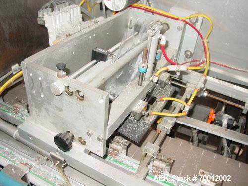 Used Axon EZ-2-400 Twin Head Stainless Steel Neck Bander With Twin Stainless Steel Heat Tunnels. Capable of speeds up to 90 CPM. Container size range widths from 3-11/16" to 9-7/8" and sleeve lay fla...