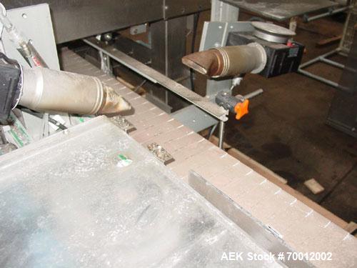 Used Axon EZ-2-400 Twin Head Stainless Steel Neck Bander With Twin Stainless Steel Heat Tunnels. Capable of speeds up to 90 CPM. Container size range widths from 3-11/16" to 9-7/8" and sleeve lay fla...