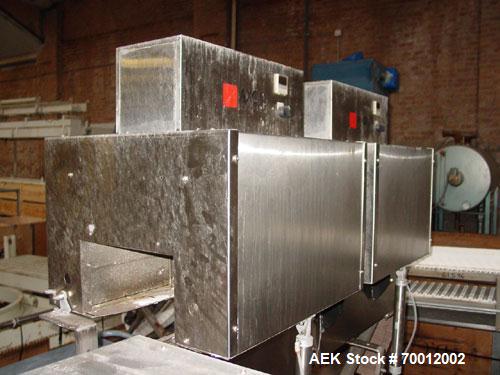 Used Axon EZ-2-400 Twin Head Stainless Steel Neck Bander With Twin Stainless Steel Heat Tunnels. Capable of speeds up to 90 CPM. Container size range widths from 3-11/16" to 9-7/8" and sleeve lay fla...