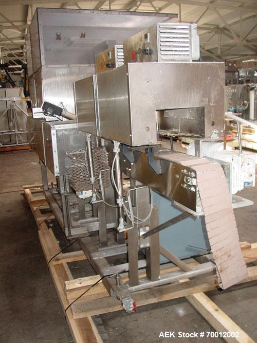 Used Axon EZ-2-400 Twin Head Stainless Steel Neck Bander With Twin Stainless Steel Heat Tunnels. Capable of speeds up to 90 CPM. Container size range widths from 3-11/16" to 9-7/8" and sleeve lay fla...