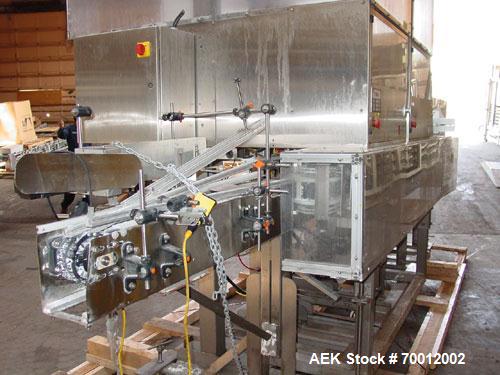 Used Axon EZ-2-400 Twin Head Stainless Steel Neck Bander With Twin Stainless Steel Heat Tunnels. Capable of speeds up to 90 CPM. Container size range widths from 3-11/16" to 9-7/8" and sleeve lay fla...