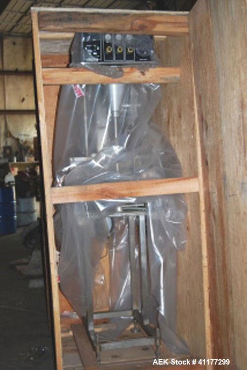 Used Kalsih Bandit Neck Bander, model 5400. Manually adjustable size range, and height. Driven by a 1/6hp, 1/60/120 volt motor. Mounted on a stainless steel frame. Built 1993