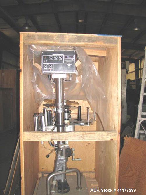 Used Kalsih Bandit Neck Bander, model 5400. Manually adjustable size range, and height. Driven by a 1/6hp, 1/60/120 volt motor. Mounted on a stainless steel frame. Built 1993