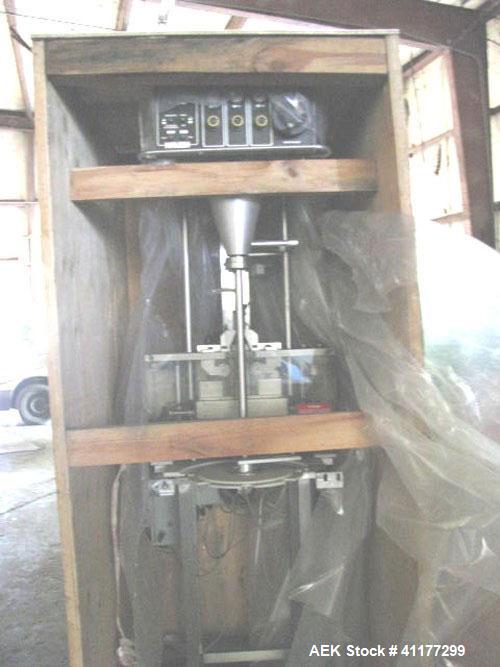 Used Kalsih Bandit Neck Bander, model 5400. Manually adjustable size range, and height. Driven by a 1/6hp, 1/60/120 volt motor. Mounted on a stainless steel frame. Built 1993