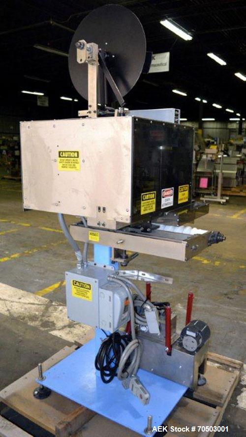 Used PDC Model 65M Tamper Evident Neck Banding Machine. Capable of speeds up to 200 bottles per minute. Band Diameter:3/8" to 3". Band Height 3/4" - 2". Set up for clear or continuous print film (no ...