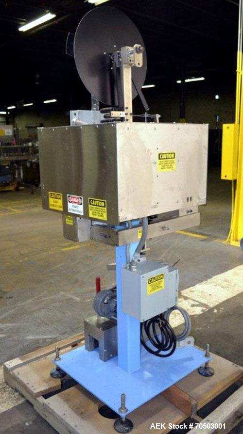 Used PDC Model 65M Tamper Evident Neck Banding Machine. Capable of speeds up to 200 bottles per minute. Band Diameter:3/8" to 3". Band Height 3/4" - 2". Set up for clear or continuous print film (no ...